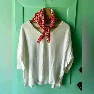 SURVIVAL - white oversized v-neck sweater, fitted elbow length sleeves. …